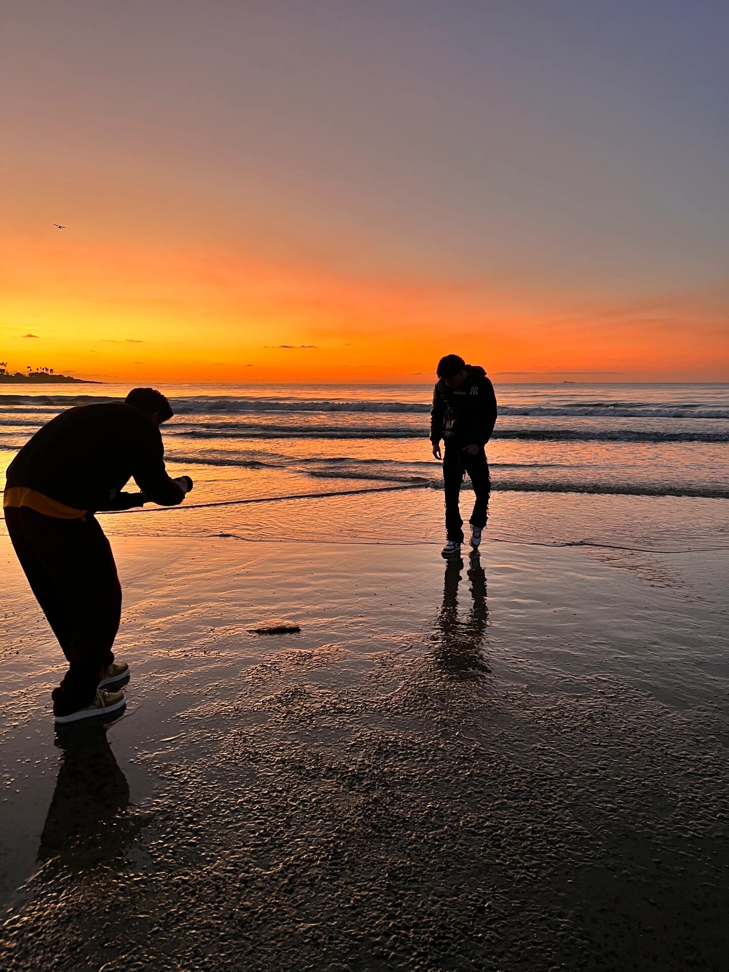 Filming on the beach during a sunset shoot