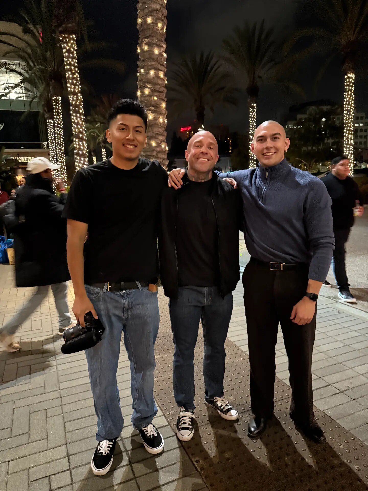 Night out with collaborators under lit palm trees